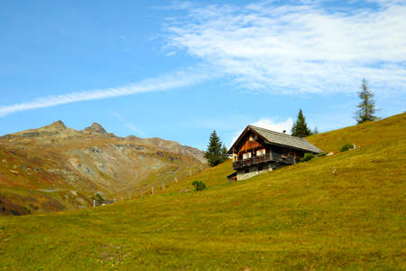 Beautiful small wooden house on a mountainsideの写真素材