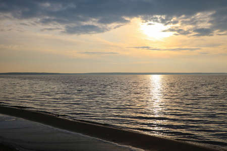 Beautiful sunset by the sea. Dark skyの写真素材