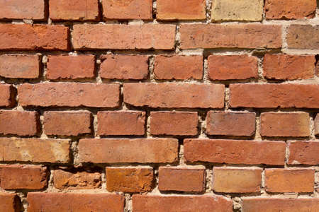 The wall of a building or structure made of red brick. Background, textureの写真素材