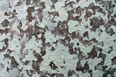 View of a sheet of metal with peeled paint. Background, textureの写真素材