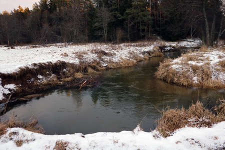 View of a small meandering river on a winter dayの写真素材
