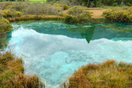 A beautiful small mountain lake in Slovenia in autumnの写真素材