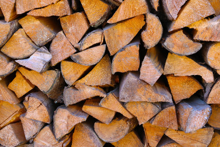 Chopped wood is in a stack for kindling the stove in winter