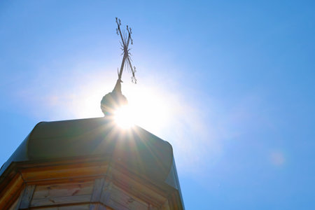 The dome of an old wooden church against the skyの写真素材