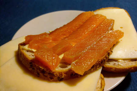 A sandwich with cheese and slices of smoked salmonの写真素材