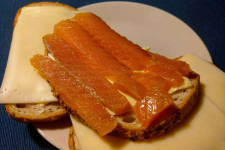 Delicious sandwich with butter, cheese and smoked fishの写真素材