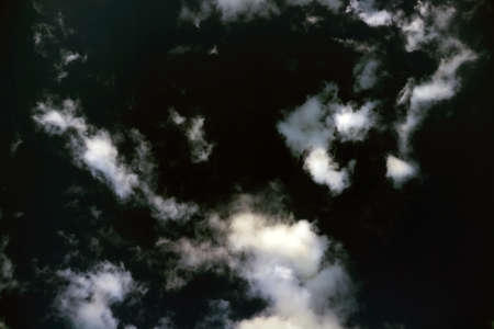 White clouds on a dark background. View from aboveの写真素材
