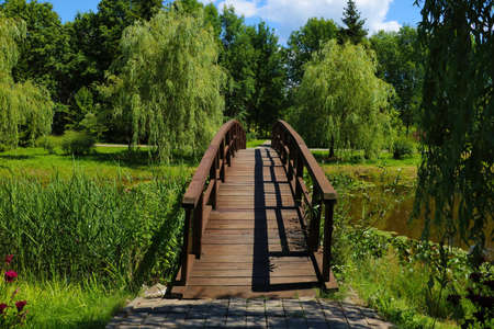 A beautiful wooden walkway across the lakeの写真素材