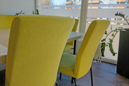 View of yellow chairs in a modern officeの写真素材