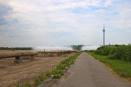 View of rusty production pipes on a clear dayの写真素材