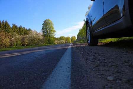 The car is parked on the side of the road. The technique has broken downの写真素材