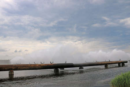 Industrial pipes with industrial water for cooling. Used in power plants and nuclear power plantsの写真素材