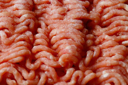 Close-up on red frozen minced meat. Backgroundの写真素材