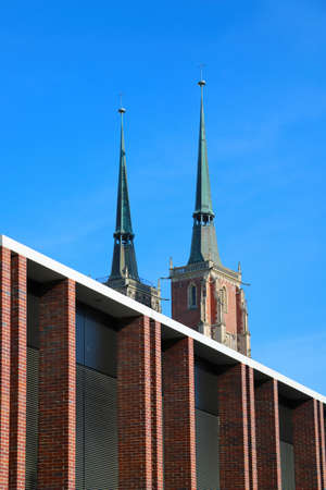 Wroclaw, Poland, May 2, 2021: Church spiers against the blue skyのeditorial素材