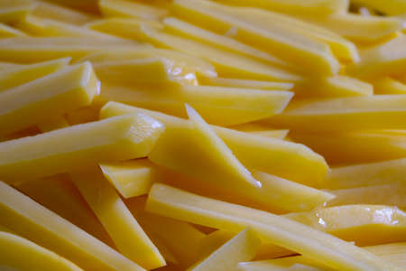 Sliced potato slices in a skillet. Cookingの写真素材