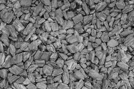 Black and white photo. The texture of the stones on the groundの写真素材