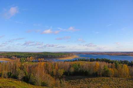 View from a height of the lake and forest in autumnの写真素材