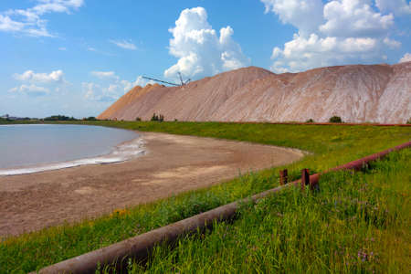 View of the extraction of potash fertilizers, minerals. Mountains of empty ore when mining potassium. Mining industry in Soligorsk, Belarusの写真素材