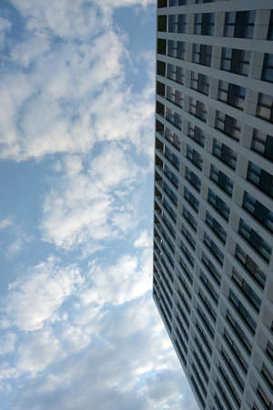 The wall of a modern building against a blue skyの写真素材