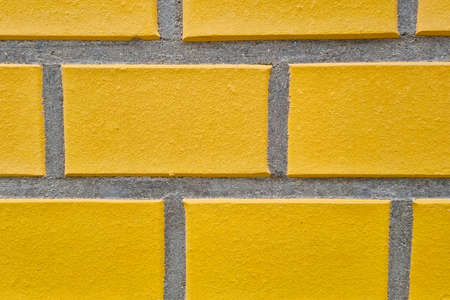 Yellow brick wall of the building, background, concrete textureの写真素材