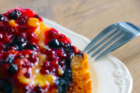 Out of focus, blurry background, a piece of cake on a plateの写真素材