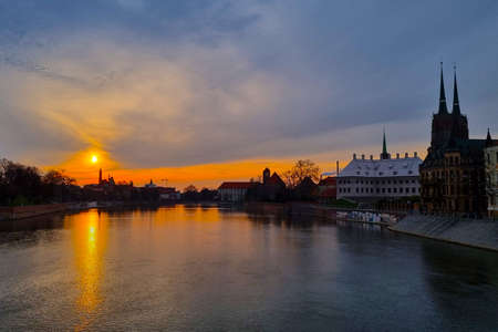 Wroclaw, Poland, August 14, 2021: picturesque sunset on the river bank in the old part of the cityのeditorial素材