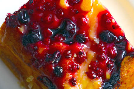 Top view of the dessert of wild berries with tea or coffee