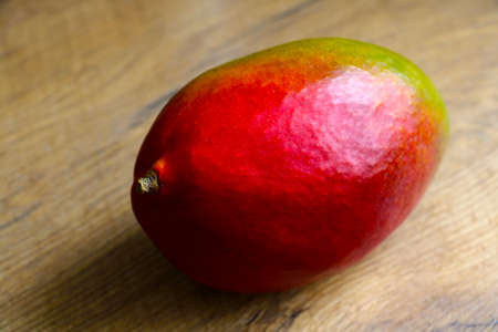 Ripe beautiful mango on the table. Healthy foodの写真素材
