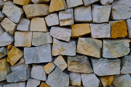 View of the stone wall of the fence, background, texture of the stoneの写真素材