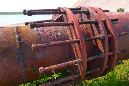 A close-up of a rusty large industrial pipeの写真素材