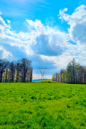 High-voltage wires against the background of a blue sky. Clean energyの写真素材