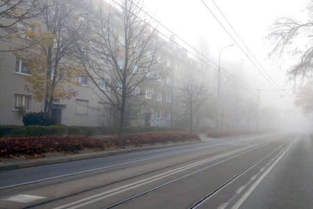 Big heavy fog in the city. Foggy autumn morning in the city. Danger when drivingの写真素材