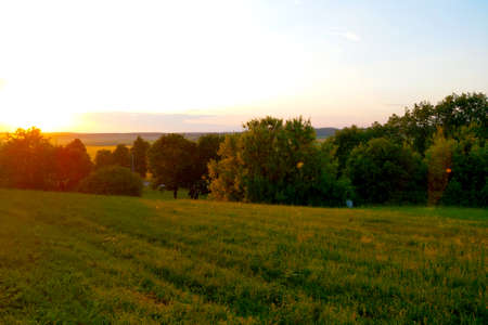 Beautiful scenic sunset in the countryside on a summer dayの写真素材