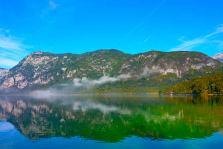 A picturesque view of the mountain lake on a sunny autumn dayの写真素材