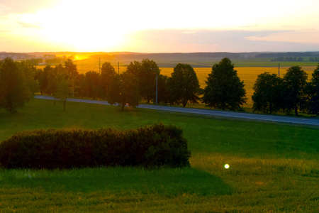 Beautiful bright sunset in the summer in the countryside