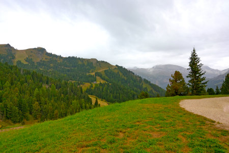 A picturesque view of the mountains on a cloudy foggy morningの写真素材