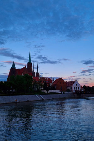 Wroclaw, Poland, May 15, 2021: Scenic sunset on the banks of the Odra River in Wroclaw. Cathedral in the evening.のeditorial素材