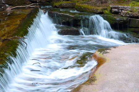 Beautiful little waterfall of the river in the forestの写真素材