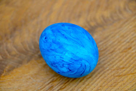 Beautiful painted egg on the table. The onset of Easter is a spring festivalの写真素材