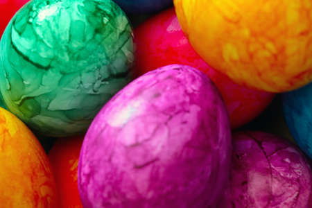 Blurry background, out of focus. Colorful eggs. Preparing for Easter