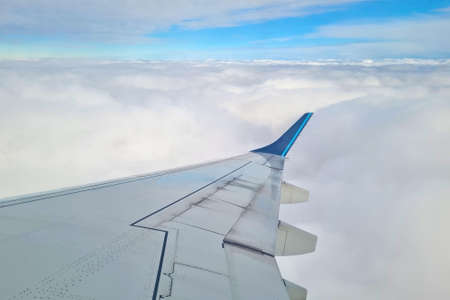 beautiful view of the clouds from the window of the flying planeの写真素材