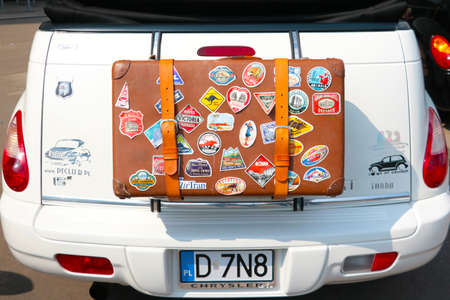 Wroclaw, Poland, August 22, 2021: Beautiful leather suitcase on the car with stickers. Travelling by carのeditorial素材