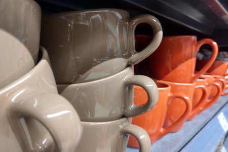 A large pin on ceramic mugs on the store shelfの写真素材