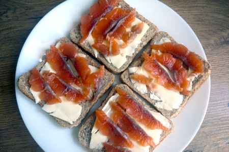 A plate of red fish sandwiches. Light breakfastの写真素材