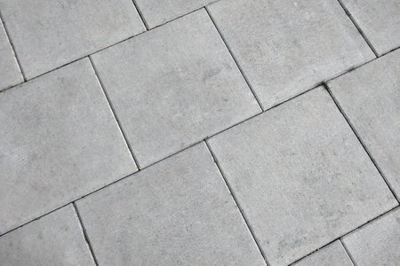 View of the gray pedestrian tiles in the city