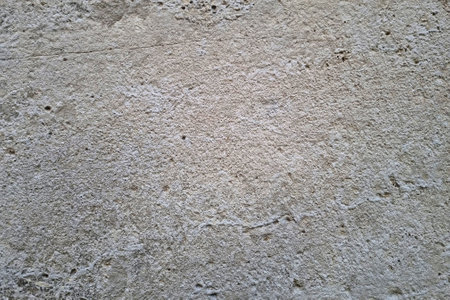 View of the concrete wall of the building, gray background, texture