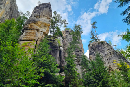 Beautiful rocks in the forest against the blue skyの写真素材