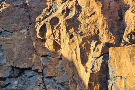 Close-up on the rock surface. Stone background. Surface texture. Abstract stone texture.