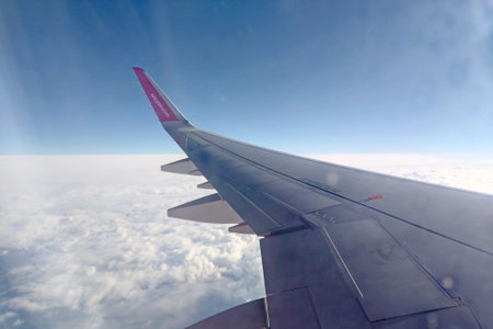 Katowice, Poland, November 22, 2022: the plane flies above the clouds.のeditorial素材