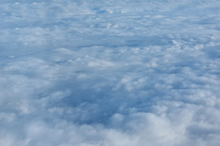 View of the white clouds from the height of the flying aircraft